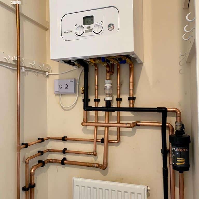 New combi boiler installed by EcoGas with neat copper pipework and magnetic filter